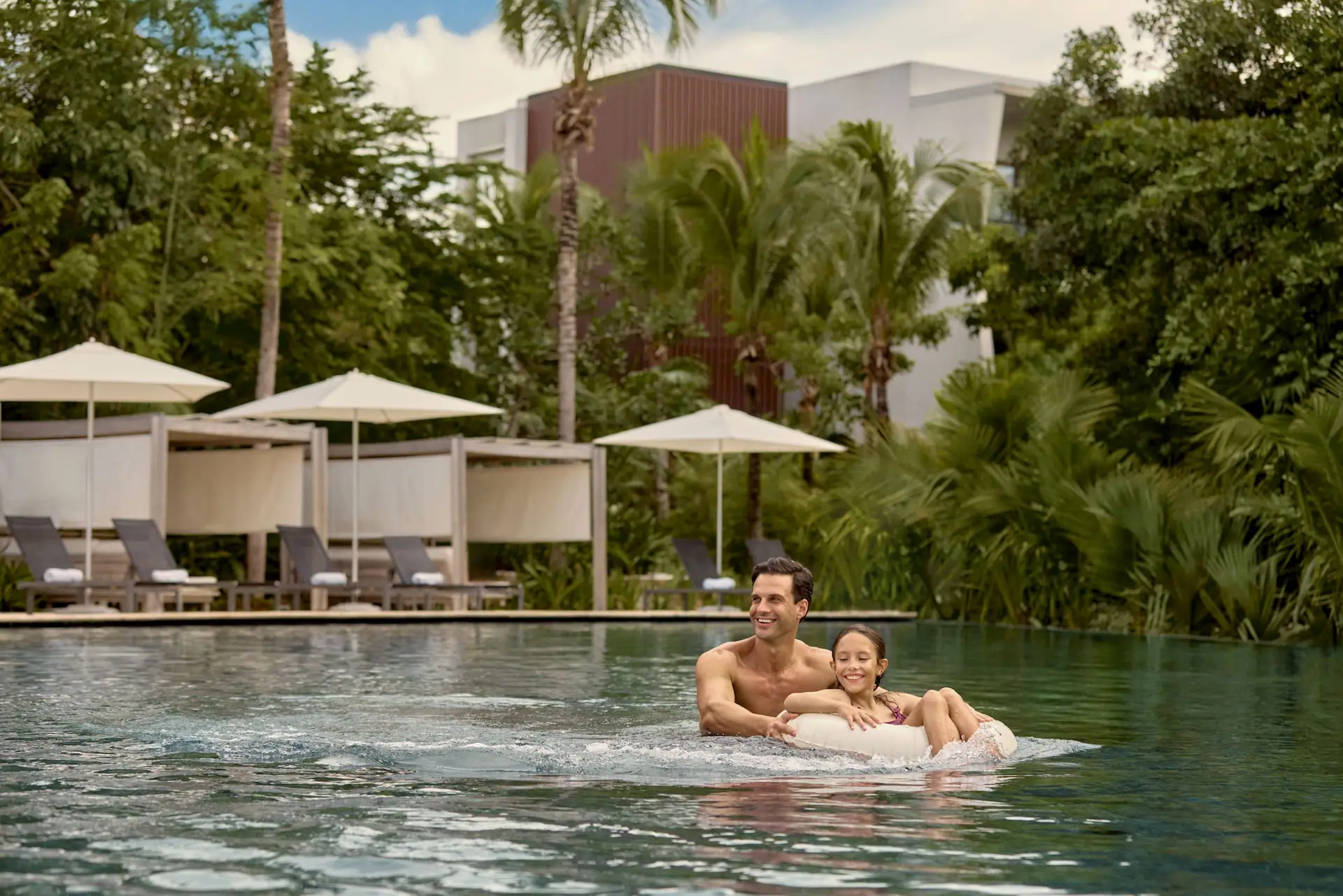 Conrad Tulum Riviera Maya, Family Friendly Vacation. Kids friendly luxury resort, pool experience. Lifestyle Brand Photo.
