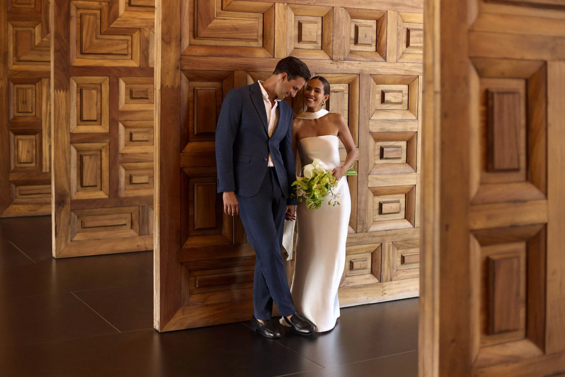 Bride and groom sharing a candid lifestyle moment at Conrad Tulum Riviera Maya during their wedding.